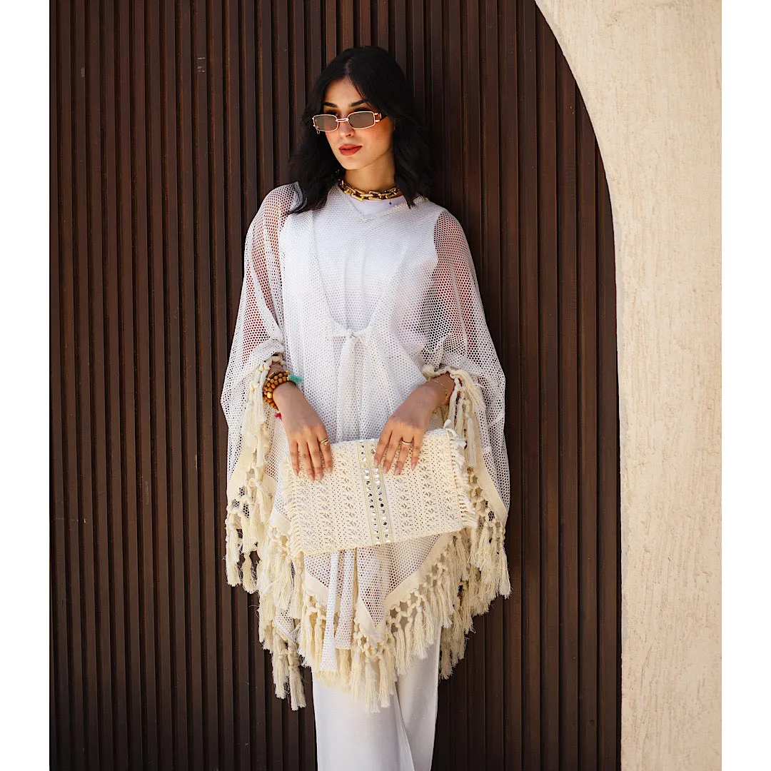 Open knit tasseled poncho