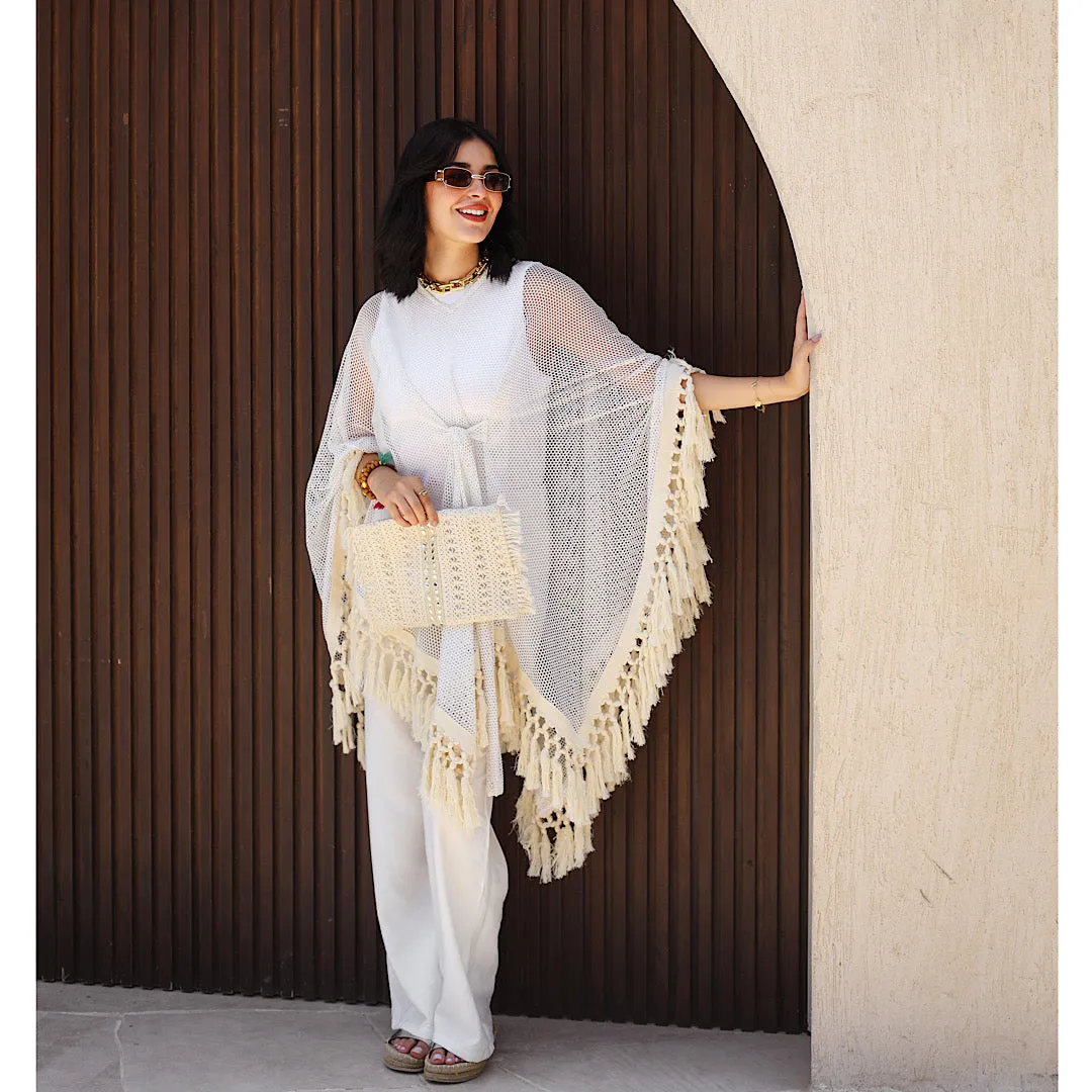 Open knit tasseled poncho