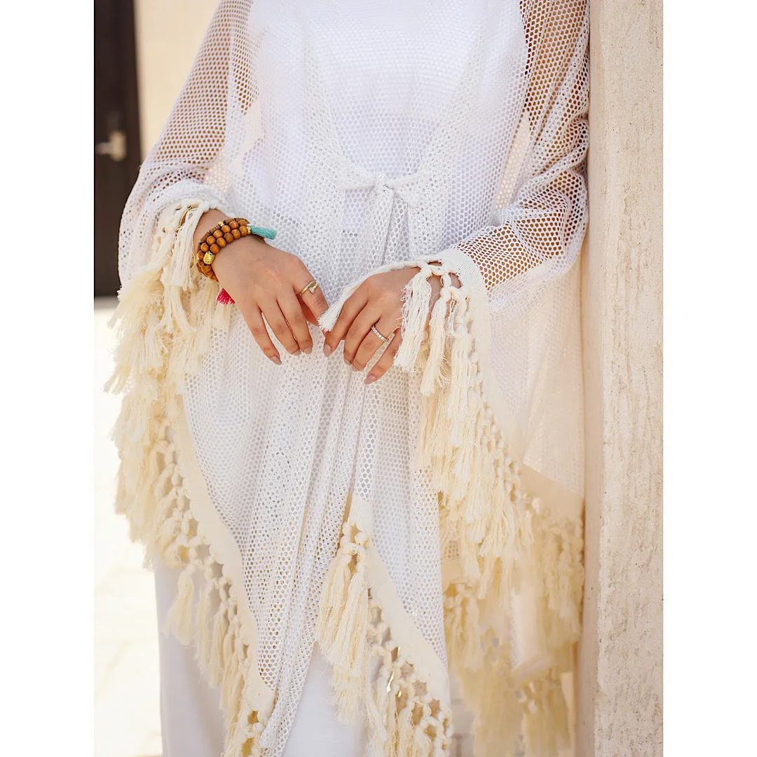 Open knit tasseled poncho